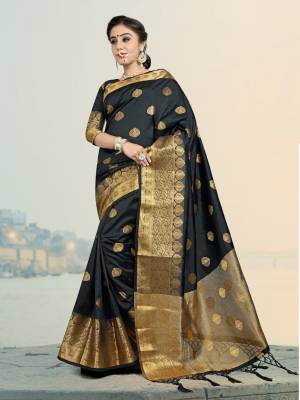 Add This Lovely Attractive Looking Saree In Black Color Paired With Black Colored Blouse. This Lovely Saree And Blouse Are Silk based Which Give A Rich And Elegant Look To Your Personality. 