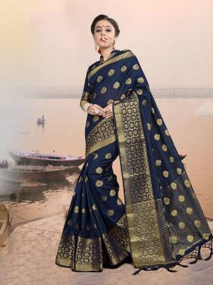 This Festive Season, Adorn A Rich And Elegant Looking Silk Based Saree In Navy Blue Color Paired With Navy Blue Colored Blouse. Its Fabric And Color Will Earn You Lots Of Compliments From Onlookers. 