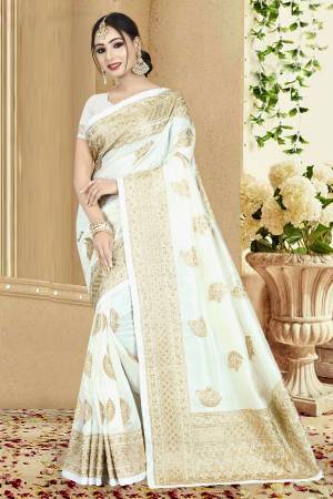 Simple And Elegant Looking Designer Saree Is Here In White Color Paired With White Colored Blouse. This Saree And Blouse Are Fabricated On Art Silk Beautified With Heavy Attractive Embroidery. 