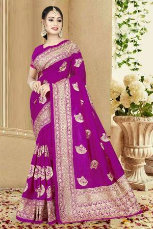 Adorn The Pretty Angelic Look Wearing This Designer Silk Based Saree In Magenta Pink Color Paired With Magenta Pink Colored Blouse. This Saree And Blouse Are Fabricated On Art Silk Beautified With Heavy Embroidery All Over. 