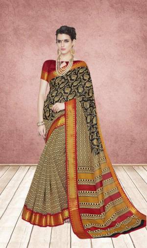 Flaunt Your Rich and Elegant Taste Wearing This Rich looking Saree In Black And Cream Color Paired With Maroon Colored Blouse. This Saree And Blouse are Cotton Silk Based Beautified With Prints. 