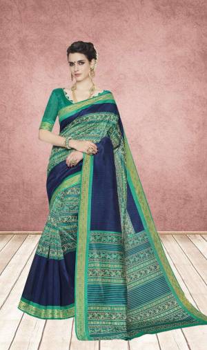 For This Festive Season, Grab This Pretty Saree In Sea Green And Navy Blue Color Paired With Sea Green colored Blouse. This Saree And Blouse Are Cotton Silk Based Which Is Easy To Carry All Day Long.