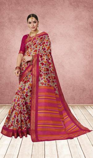 Look Pretty Wearing This Saree In Pink And Grey Color Paired With Dark Pink Colored Blouse. This Saree And Blouse Are Fabricated On Cotton Silk Beautified With Contrasting Floral Prints All Over It.