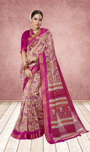 Here Is A Pretty Saree In Pink And Cream Color Paired With Dark Pink Colored Blouse. This Saree And Blouse Are Fabricated On Cotton Silk Beautified With Bold Prints.