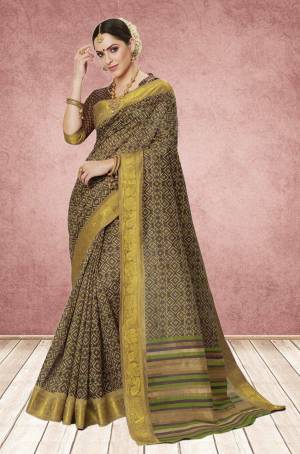For A Lady Like Elegant Look, Grab This Brown Colored Saree Paired With Brown Colored Blouse. This Saree And Blouse Are Fabricated On Cotton Silk Beautified With Intricate Prints All Over The Saree. Buy This Rich Designer Saree Now.