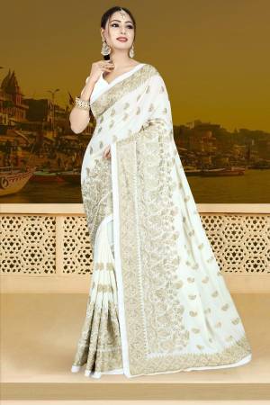 Simple And Elegant Looking Designer Saree Is Here In White Color Paired With White Colored Blouse. This Saree Is Fabricated On Silk Georgette Paired With Art Silk Fabricated Blouse. Buy This Now.