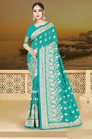 Simple And Elegant Looking Designer Saree Is Here In Turquoise Blue Color Paired With Turquoise Blue Colored Blouse. This Saree Is Fabricated On Silk Georgette Paired With Art Silk Fabricated Blouse. Buy This Now.