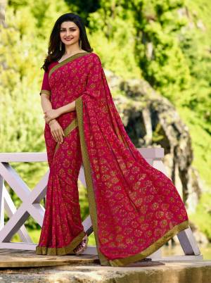 Bright And Visually Appealing Color Is Here With This Designer Saree In Dark Pink Color Paired With Dark Pink Colored Blouse. This Saree Is Georgette Based Beautified With Prints Paired With Art Silk Fabricated Blouse. 