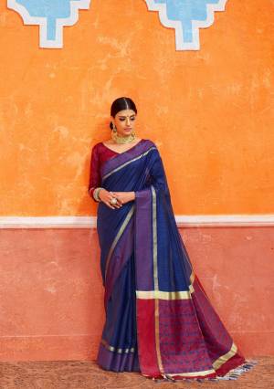 For a Royal Look, Grab This Silk Based Saree In Navy Blue Color Paired With Maroon Colored Blouse. This Saree And Blouse Are Fabricated On Handloom Art Silk Beautified With Weave. Its Rich Color And Fabric Will Earn You Lots Of Compliments From Onlookers. 