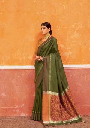 Celebrate This Festive Wearing This Lovely Shade In Olive Green Colored Saree Paired With Contrasting Musturd Yellow Colored Blouse. This Saree And Blouse Are Fabricated On Handloom Art Silk Beautified With Weave Over Its Pallu. 