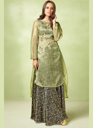 You Will Definitely Earn Lots Of Compliments Wearing This Designer Readymade Gown In  Dark Grey Color Paired With Contrasting Pastel Green Colored Top. Its Top Is Satin Based Paired With Orgenza Fabricated Embroidered Top.