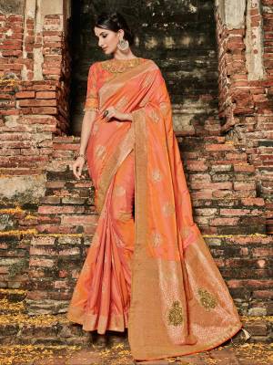 marvelously charming is what you will look at the next wedding gala wearing this beautiful orange color banarasi silk jacquard saree. Ideal for party, festive & social gatherings. this gorgeous saree featuring a beautiful mix of designs. Its attractive color and designer heavy embroidered design, zari resham work, banarasi silk sarees, beautiful floral design work over the attire & contrast hemline adds to the look. Comes along with a contrast unstitched blouse.