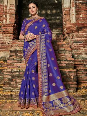 Look your ethnic best by wearing this Violet color banarasi silk jacquard saree. Ideal for party, festive & social gatherings. this gorgeous saree featuring a beautiful mix of designs. Its attractive color and designer heavy embroidered design, zari resham work, banarasi silk sarees, beautiful floral design work over the attire & contrast hemline adds to the look. Comes along with a contrast unstitched blouse.