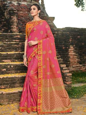 Look gorgeous in this beautiful printed Dark pink color banarasi silk jacquard saree. Ideal for party, festive & social gatherings. this gorgeous saree featuring a beautiful mix of designs. Its attractive color and designer heavy embroidered design, zari resham work, moti work, banarasi silk sarees, beautiful floral design work over the attire & contrast hemline adds to the look. Comes along with a contrast unstitched blouse.