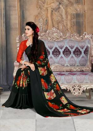 For A Bold and Beautiful Look, Grab This Georgette Based Saree In Black Color Paired With Red Colored Blouse. It Has Pretty Satin Patta With Polka Prints Over Border. 
