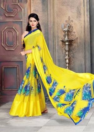 Look Attractive In This Pretty Yellow Colored Saree Paired With Contrasting Royal Blue Colored Blouse. This Saree Is Georgette Based With Satin Patta And Bold Prints Over It. Buy Now.