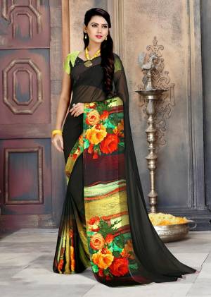 Add This Bold Looking Saree To Your Wardrobe For Casual Or Semi-Casual Wear In Black And Multi Color Paired With Black And Green Colored Blouse. This Saree Is Fabricated On Georgette Paired With Satin Georgette Blouse. 