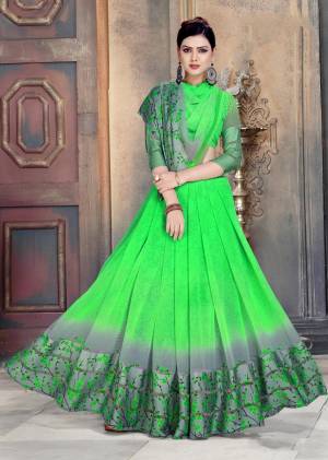 Here Is An Attractive Looking Shade With This Saree In Parrot Green Color Paired With Parrot Green Colored Blouse. This Saree And Blouse Are Georgette Based Beautified With Prints And Satin Patta.