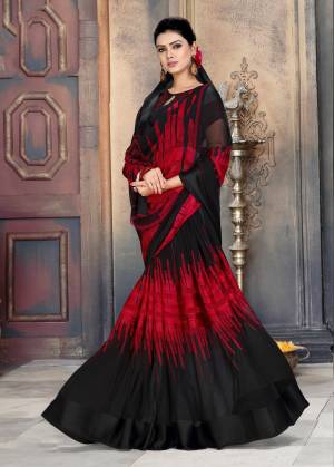 Add This Bold Looking Saree To Your Wardrobe For Casual Or Semi-Casual Wear In Black And Maroon Color Paired With Black Colored Blouse. This Saree Is Fabricated On Georgette Paired With Satin Georgette Blouse. 