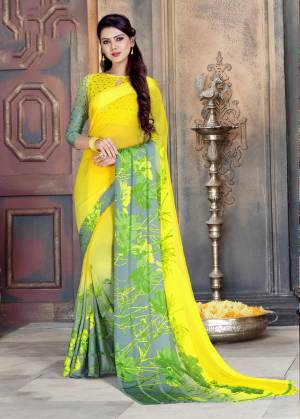 Look Attractive Wearing This Saree In Yellow And Grey Color Paired With Yellow And Grey Colored Blouse. This Saree Is Georgette Based Paired With Satin Georgette Blouse. It Is Soft Towards Skin And Easy To Carry All Day Long.