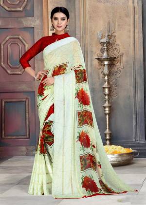 Simple and Elegant Looking Saree Is Here In Off-white Color Paired With Red Colored Blouse. This Saree And Blouse Are Georgette Based Beautified With Prints All Over It.