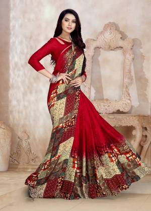 Adorn The Pretty Angelic Look Wearing This Saree In Red And Multi Color Paired With Red Colored Blouse. It Is Fabricated On Satin Georgette Beautified With Prints All Over. 