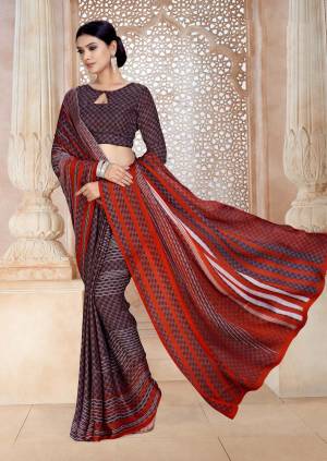 Pretty Looking Saree Is Here In Purple And Red Color Paired With Purple Colored Blouse. This Saree And Blouse Are Fabricated On Satin Georgette Beautified With Intricate Prints All Over It.