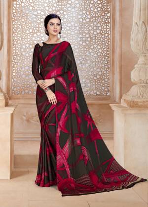 Add This Beautiful Looking Saree To Your Wardrobe In Brown And Pink Color Paired With Brown And Pink Colored Blouse. This Saree And Blouse Are Satin Georgette Based With Minimal Prints. Also It Is Soft Towards Skin And Easy To Carry All Day Long.