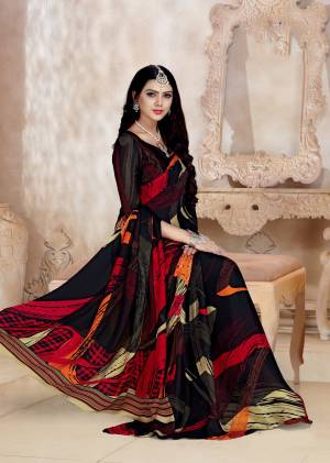 Enhance Your Personality Wearing This Black Color Paired With Black Colored Blouse. This Saree And Blouse Are Fabricated On Satin Georgette Beautified With Bold Prints. 