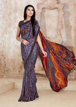 Add This Pretty Saree To Your Wardrobe In Multi Color Paired With Brown Colored Blouse. This Saree And Blouse  Are Fabricated On Satin Georgette Beautified With Prints. Buy Now.
