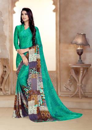 For Your Casual Wear, Grab This Saree In Sea Green Color Paired With Sea Green Colored Blouse. This Saree And Blouse Are Fabricated On Satin Georgette Beautified With Prints all Over It. 