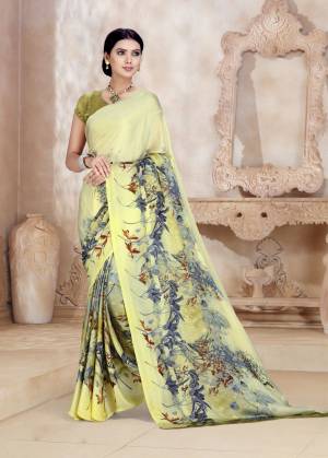 This Season Is About Subtle Shades And Pastel Play, Grab This Saree In Pastel Yellow Color Paired With Pear Green Colored Blouse. This Saree And Blouse Are Fabricated On Satin Georgette Beautified With Prints Over The Panel.