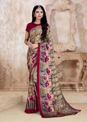 Add This Very Pretty Light Brown Colored Saree Paired With Contrasting Dark Pink Colored Blouse. This Saree And Blouse Are Fabricated On Satin Georgette Beautified With Prints. 