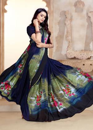 Enhance Your Personality Wearing This Elegant Looking Saree In Navy Blue Color Paired With Navy Blue Colored Blouse. This Saree And Blouse Are Fabricated On Satin Georgette Beautified With Prints.