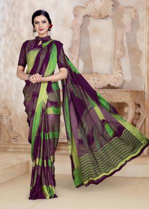 Unique Color And Patterned Saree Is Here In Purple and Green Color Paired With Purple Colored Blouse. This Saree And Blouse Are Satin Georgette Based Beautified With Prints All Over. 
