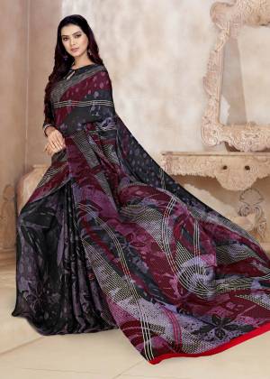 Add This Pretty Saree To Your Wardrobe In Multi Color Paired With Dark Grey Colored Blouse. This Saree And Blouse  Are Fabricated On Satin Georgette Beautified With Prints. Buy Now.