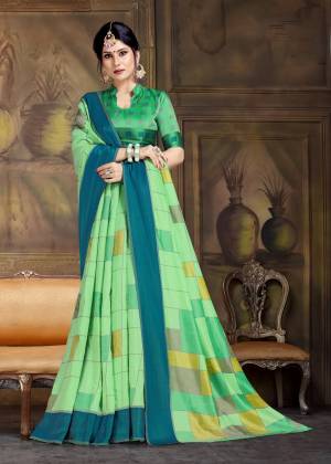 For A Proper Traditional Look, Grab This Pretty Saree In Green Color Paired With Green Colored Blouse. This Saree And Blouse Are Fabricated On Art Silk Beautified With Bold Floral Prints All Over