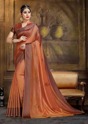 New Shade Is Here To Add Into Your Wardrobe With This Saree In Rust Color Paired With Rust Colored Blouse. This Saree And Blouse Are Fabricated On Art Silk Beautified With Prints.