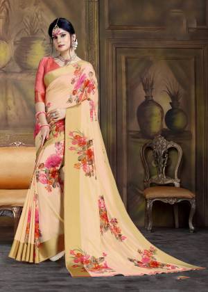 A Must Have Shade In Every Womens Wardrobe Is Here In Peach Color Paired With Contrasting Pink Colored Blouse. This Pretty Saree Has Multi Colored Floral Prints Fabricated On Art Silk. 