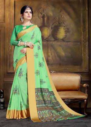 For A Proper Traditional Look, Grab This Pretty Saree In Light Green Color Paired With Light Green Colored Blouse. This Saree And Blouse Are Fabricated On Art Silk Beautified With Bold Floral Prints All Over