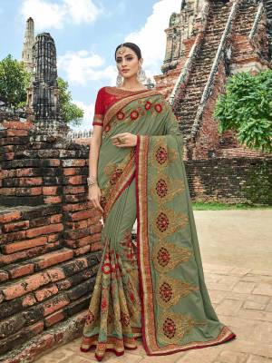 you Look striking and stunning afler wearing this Mint green and red color silk fabrics saree. look gorgeous at an upcoming any occasion wearing the saree. this party wear saree won't fail to impress everyone around you. Its attractive color and designer heavy embroidered design, zari design work, patch design, attactive sequence design, beautiful floral design all over in saree work over the attire & contrast hemline adds to the look. Comes along with a contrast unstitched blouse.