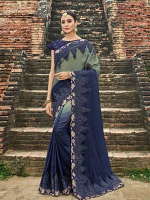 You can Get this amazing saree and look pretty like never before. wearing this grey and Navy Blue color two tone silk shaded fabrics saree. this gorgeous saree featuring a beautiful mix of designs. look gorgeous at an upcoming any occasion wearing the saree. Its attractive color and designer heavy embroidered design, patch design, attactive stone design, beautiful floral design all over in saree work over the attire & contrast hemline adds to the look. Comes along with a contrast unstitched blouse.