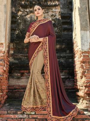 Presenting this maroon and beige color two tone silk saree. Ideal for party, festive & social gatherings. this gorgeous saree featuring a beautiful mix of designs. Its attractive color and designer heavy embroidered design, stone and zari design work, heavy designer blouse, beautiful floral design all over in saree work over the attire & contrast hemline adds to the look. Comes along with a contrast unstitched blouse.