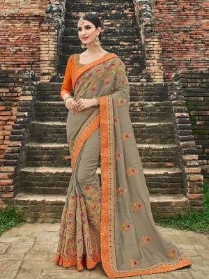 Change your wardrobe and get classier outfits like this gorgeous grey color silk fabrics saree. Ideal for party, festive & social gatherings. this gorgeous saree featuring a beautiful mix of designs. Its attractive color and designer heavy embroidered design, stone and zari design work, gotta design and heavy designer blouse, beautiful floral design all over in saree work over the attire & contrast hemline adds to the look. Comes along with a contrast unstitched blouse.