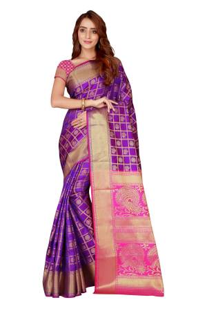 Here Is A Very Pretty Color Pallete With this Silk Based Saree In Purple And Pink Color Paired With Pink Colored Blouse. This Saree And Blouse Are Fabricated On Kanjivaram Art Silk Beautified With Heavy weave All Over It. Buy This Designer Silk Saree Now.