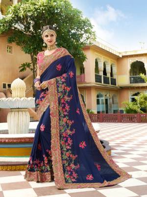 Enhance Your Personality Wearing This Designer Saree In Navy Blue Color Paired With Contrasting Pink Colored Blouse. This Saree and Blouse Are Fabricated On Silk Beautified With Heavy Embroidery Work. Also This Saree Will Earn You Lots Of Compliments From Onlookers.