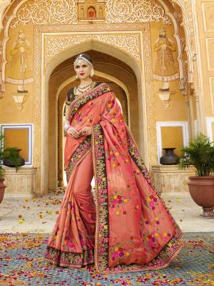 Celebrate This Festive Season Wearing This Lovely Designer Saree In Orange Color Paired With Contrasting Brown Colored Blouse. This Saree And Blouse Are Fabricated On Silk Beautified With Heavy Jari And Thread Work .