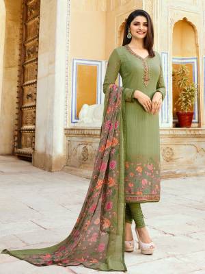 New And Unique Shade Is Here To Add Into Your Wardrobe With This Designer Straight Suit In Olive Green Color. Its Top Is Fabricated On Crepe Paired With Santoon Bottom And Chiffon Dupatta. 