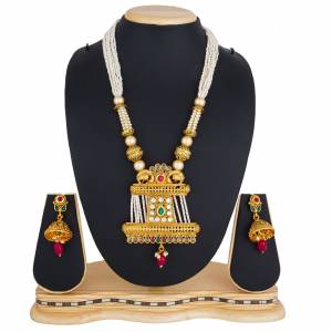 Here Is A Beautiful Long Pattern Necklace Set In Golden Color Beautified with Stone Work And Pair With A Lovely Pair Of Earrings. You Can Pair This Up With Any Colored Traditional Attire. 
