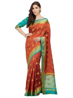 New Shade Is Here To Add Into Your Wardrobe With This Saree In Rust And Blue Color Paired With Sky Blue Colored Blouse. This Saree And Blouse Are Fabricated On Nylon Silk Beautified With Weave All Over. 